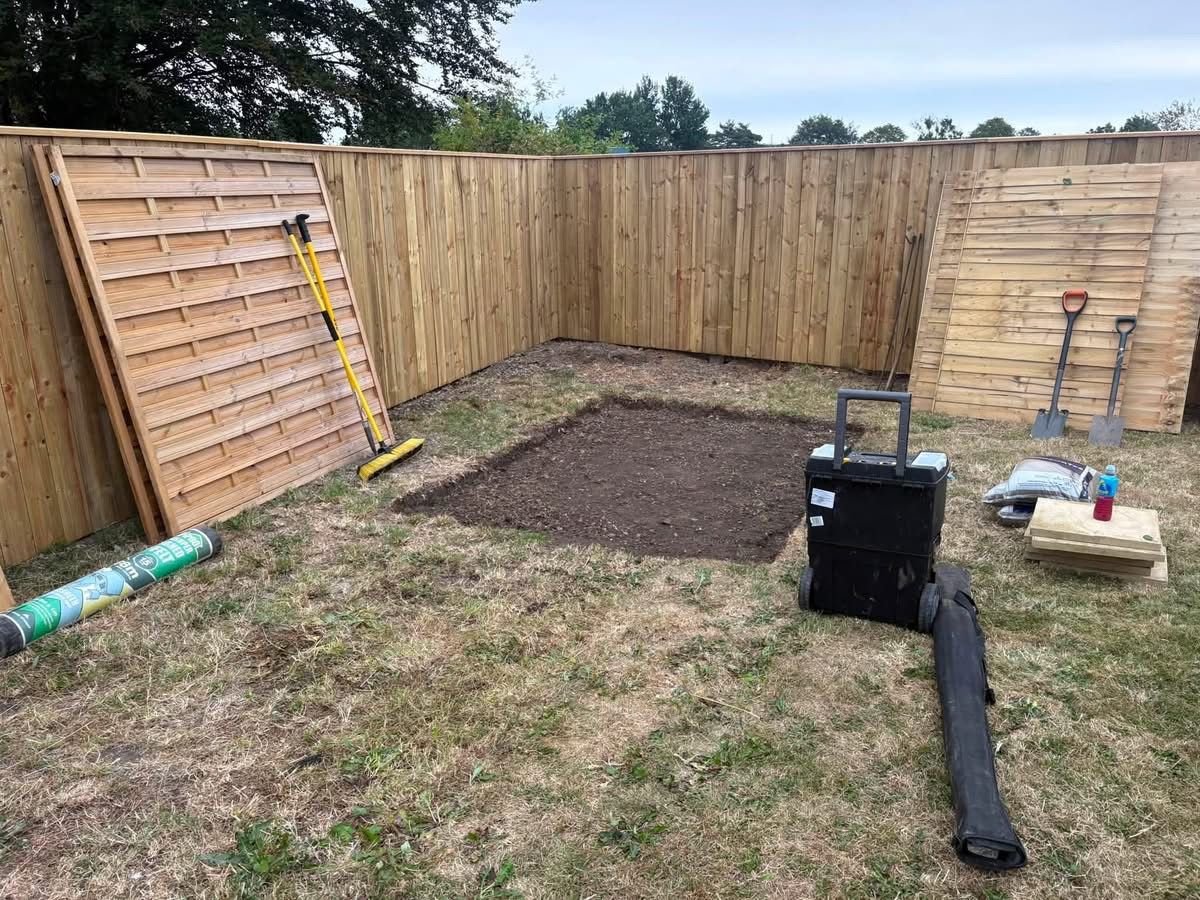 Turf stripped back for the shed footprint beside the new fence